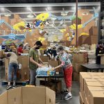 LIFE members packing boxes with water