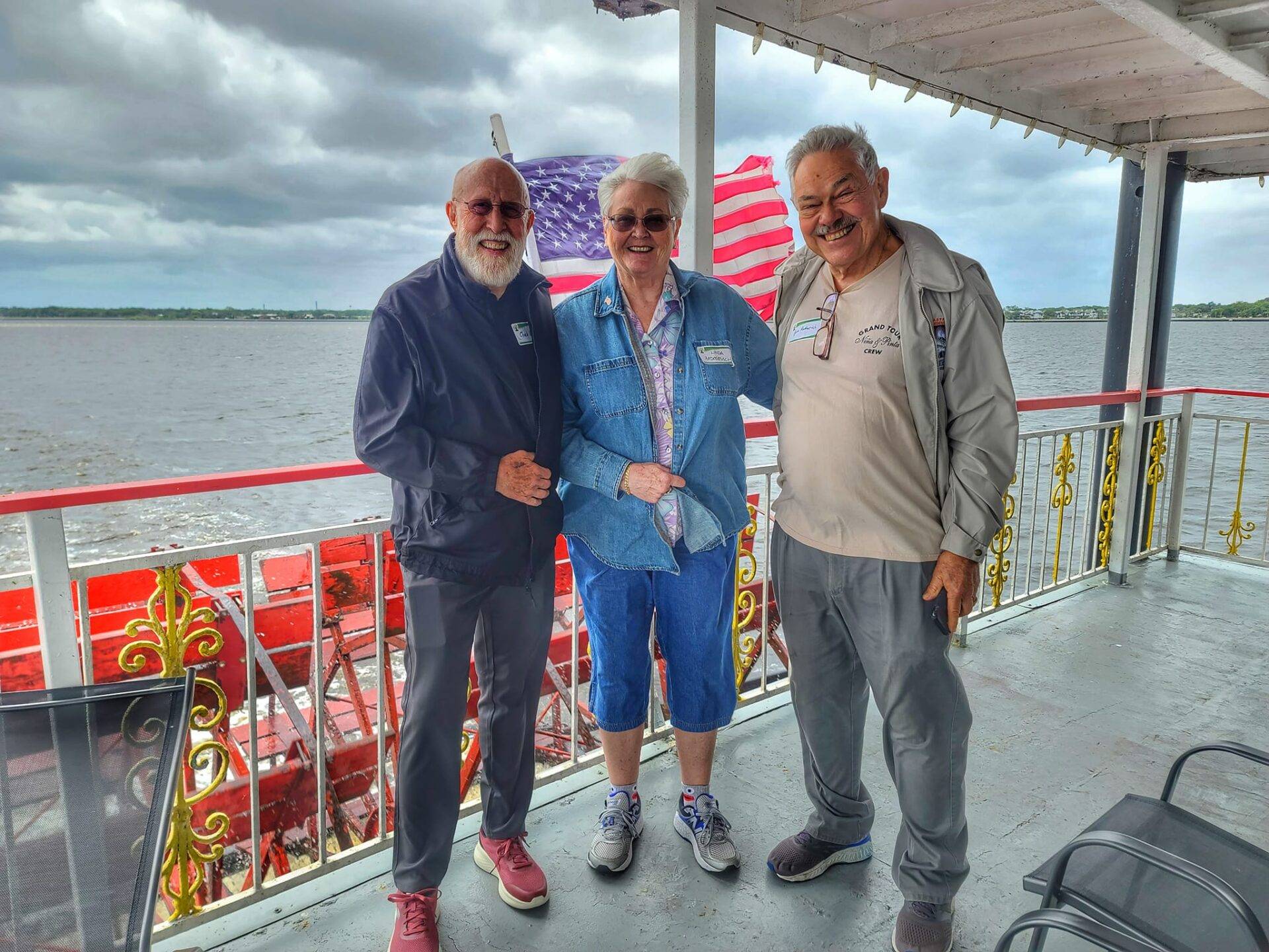 Three LIFE members standing on the deck of the Sanford Riverboat